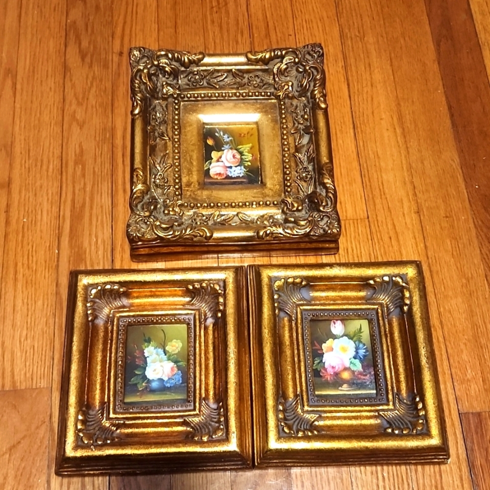 A set of three floral painting each set in a gold frame